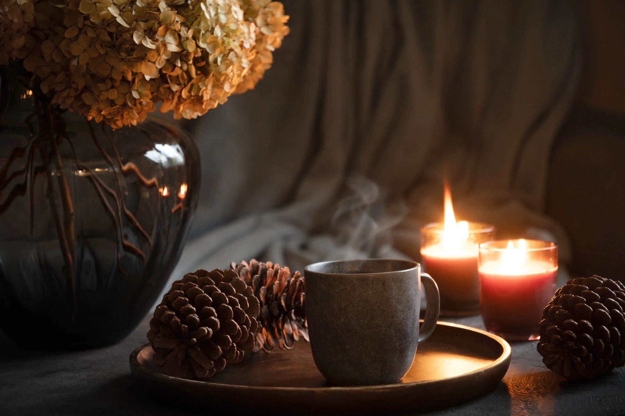 Cozy home setting with coffee and candles