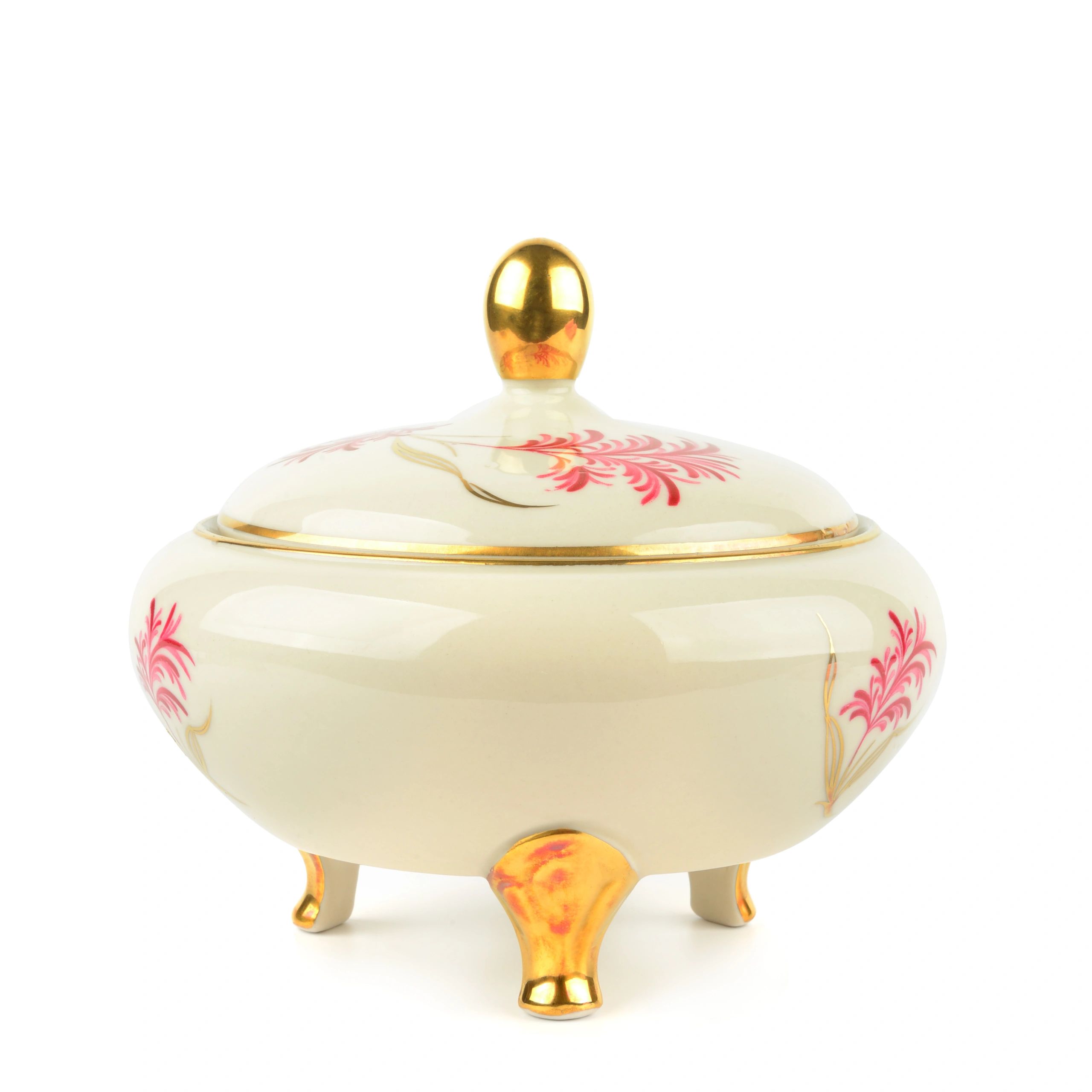 Antique ceramic candy dish with lid featuring elegant gold finish